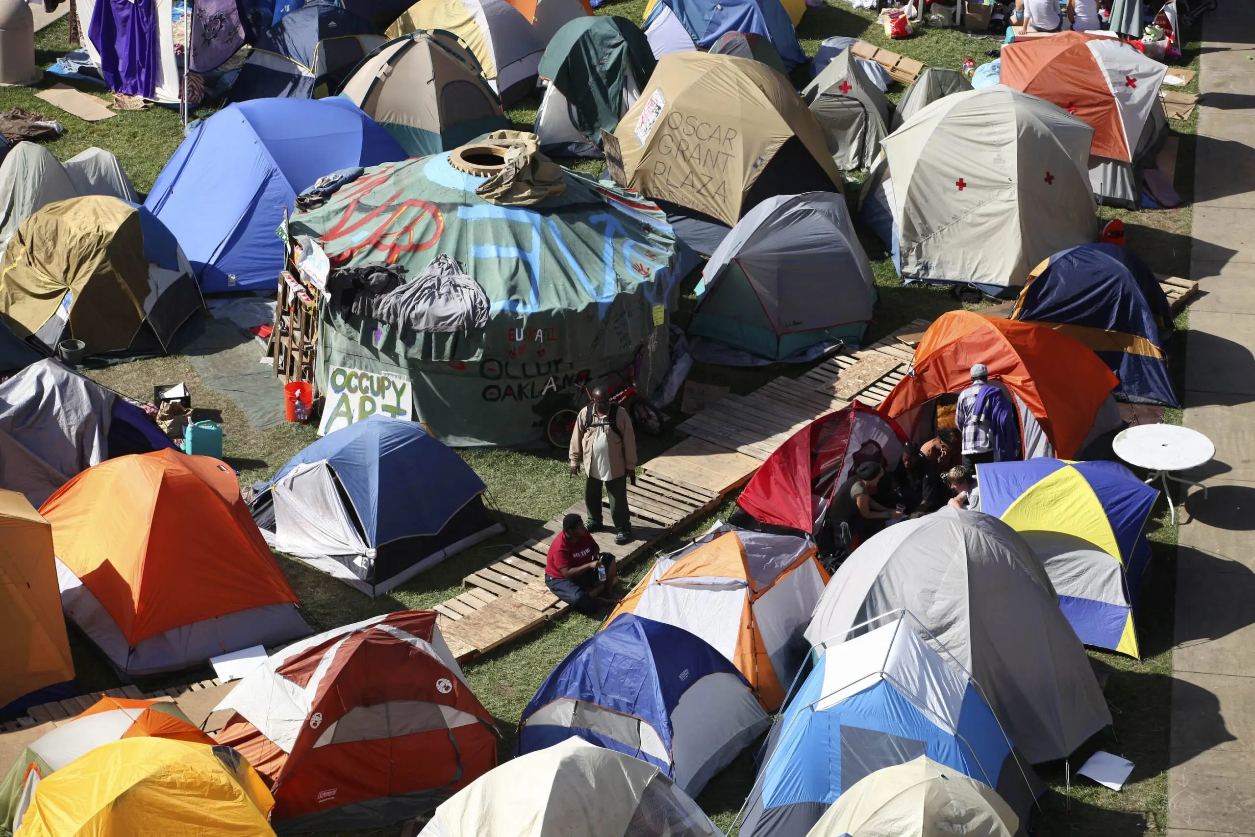 People walk among tents at the  protest in October 2011.
